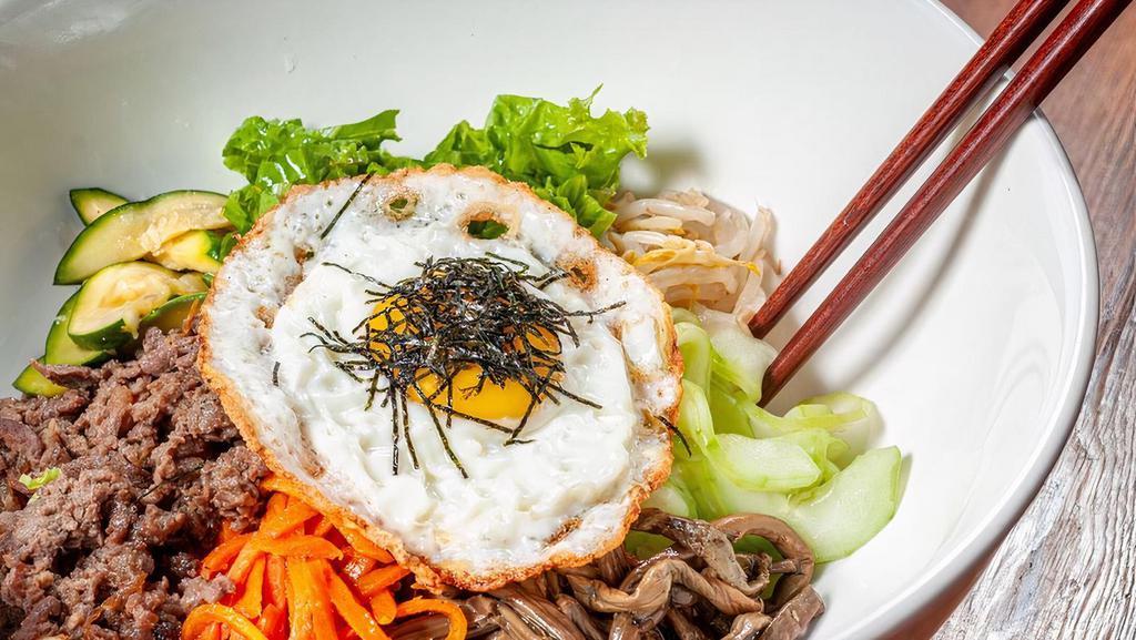 Lunch Bibimbap · Korean style beef, mixed vegetables, and pan-fried egg on top of rice.
