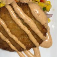 Crab Cakes · Two crab cakes served with a roasted corn salsa and chipotle aioli.
