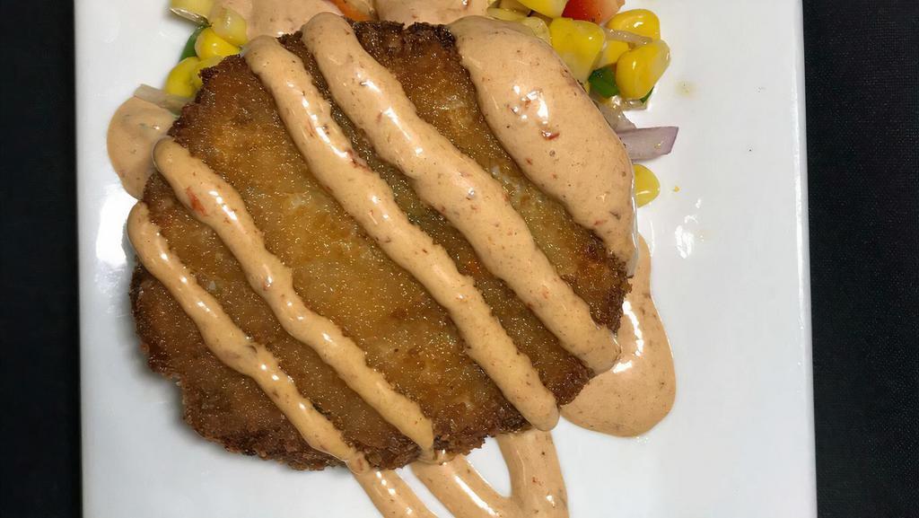 Crab Cakes · Two crab cakes served with a roasted corn salsa and chipotle aioli.