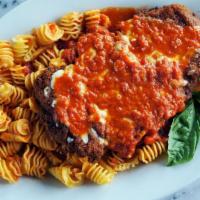 Chicken Parmigiana · Hand breaded cutlet, shredded cheese blend, tomato-basil sauce. Served with a side of penne ...