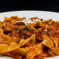 Radiatore Bolognese · Homemade radiatore pasta tossed in a blend of ground beef, pork and veal; finished in Pecori...