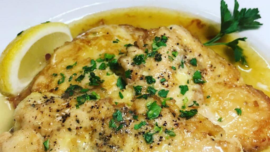 Chicken Francese · Tender all-natural chicken filets, dipped in egg batter and sautéed in a lemon butter sauce; served with potato and vegetable.