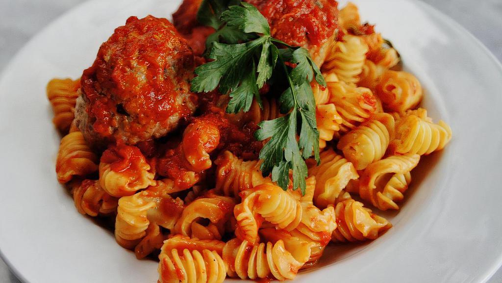 Pasta & Meatballs · Choice of penne, spaghetti, homemade radiatore or homemade pappardelle; served with two house made meatballs topped with a dollop of whole milk ricotta cheese and garlic crostini