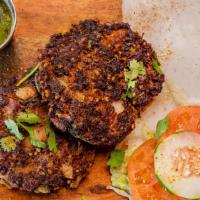 Chapli Kabab · Beef minced patties marinated in served served hot and ready, served with raita and chutni a...
