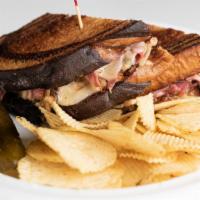 Reuben  · Pastrami, sauerkraut, swiss cheese, 1000 island dressing on grilled marble rye. Served with ...