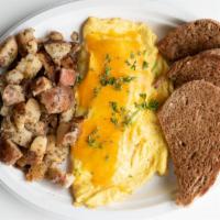 The Western Omelette · Eggs, bacon, sausage, onions, pepper and cheddar. served with a side of hash and toast