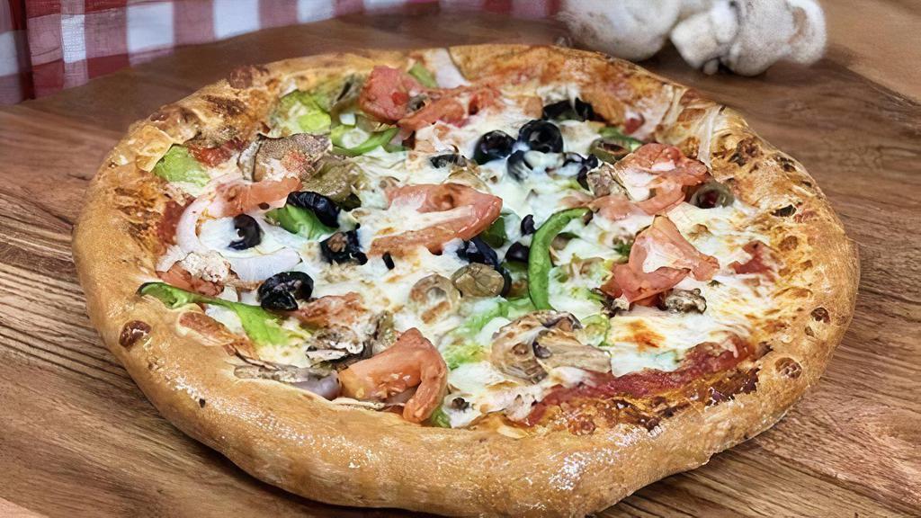 Vegetarian Pizza · Fresh sliced tomatoes, onions, green peppers, black olives, mushrooms, green olives, and extra cheese