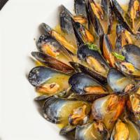 Mussels Toscano · New England mussels simmered in your choice of
roasted tomato broth or garlic white wine sau...