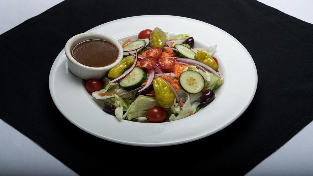 Entree House Salad · Mixed greens, carrots, cucumbers, red onion, tomatoes, Kalamata olives, and pepperoncini.