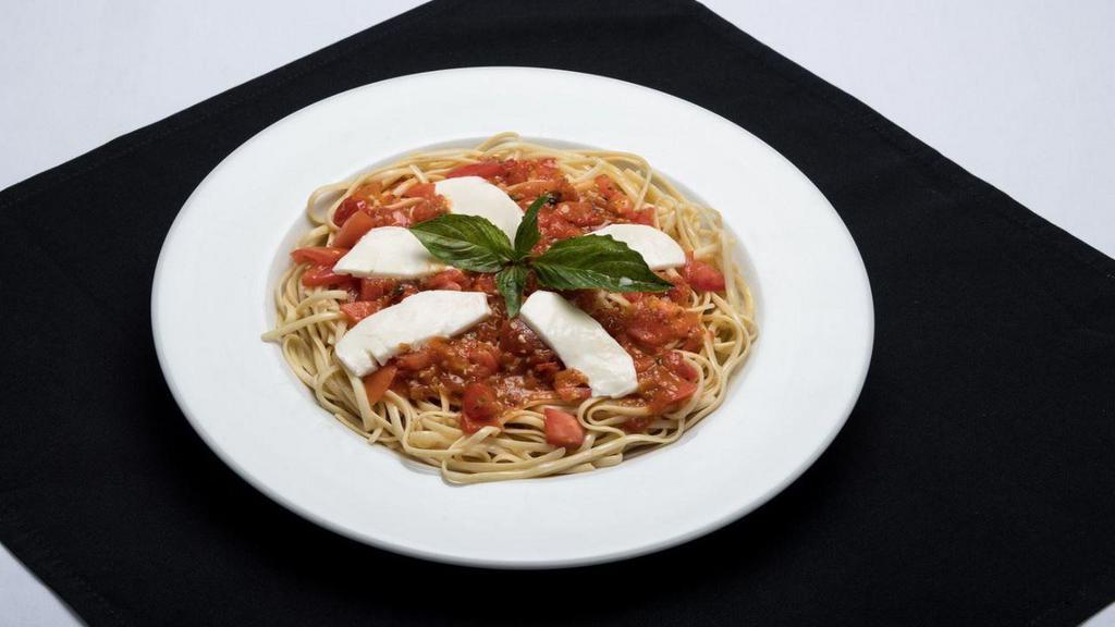 Linguini Caprese · Tomatoes and onions simmered in a garlic basil white wine, topped with fresh Buffalo mozzarella