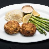 Twin Crab Cakes · Twin five ounce Jumbo lump crab cakes broiled to perfection, with creole remoulade.
