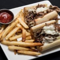 Philly Cheesesteak Sub · Shaved Philly ribeye grilled with mixed peppers and onions, topped with melted provolone, le...