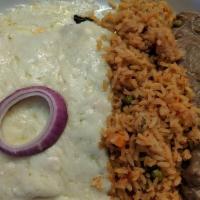 Spinach Enchiladas · (3) Spinach enchiladas topped with cream sauce and Monterey Jack cheese served with black be...