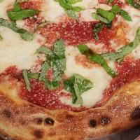 Margherita (Small) · 14' Topped with fresh basil and drizzeled with olive oil and parmesan.