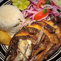 Mojarra Frita · Fine marinated whole fish, deep fried served with rice and salad.