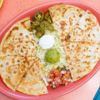 Quesadillas · Grilled flour tortillas stuffed with your choice of chicken or beef fajitas, shrimp veggies,...