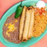 Flautas · Gluten Free. 
Three hand rolled corn tortillas stuffed with cheese and your choice of shredd...