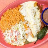 Plato Mariachi · One shredded chicken tostada two chicken enchiladas and a house made tamale.