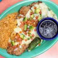 Tortiilla Crusted Flounder · Fresh gulf flounder tortilla crusted and pan fried. Topped with vaqueros sauce, avocado pico...