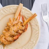Shrimp Skewers · Three skewers loaded with shrimp lightly dusted with old bay and grilled. Served with dippin...