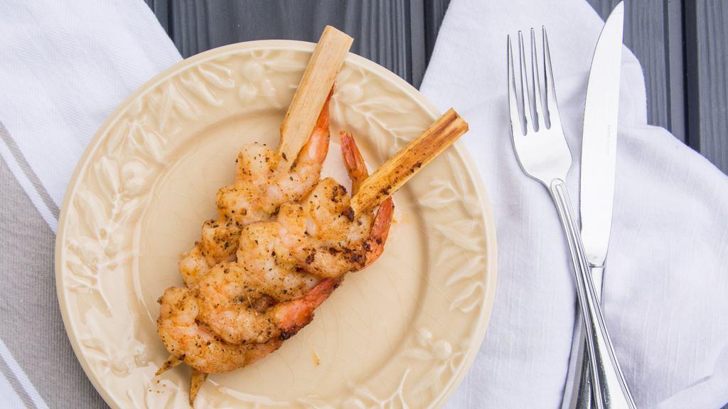 Shrimp Skewers · Three skewers loaded with shrimp lightly dusted with old bay and grilled. Served with dipping sauce.