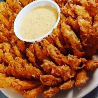 Onion Spinner · A huge onion seasoned in our special batter, deep-fried and served with our special cajun sp...