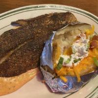 Blackened Catfish · Farm-raised catfish covered in cajun spices, seared with hot oil in a black iron skillet and...