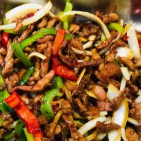 Mongolian Pork · Fresh sliced pork cooked with onions and green,  red peppers in our homemade brown sauce.