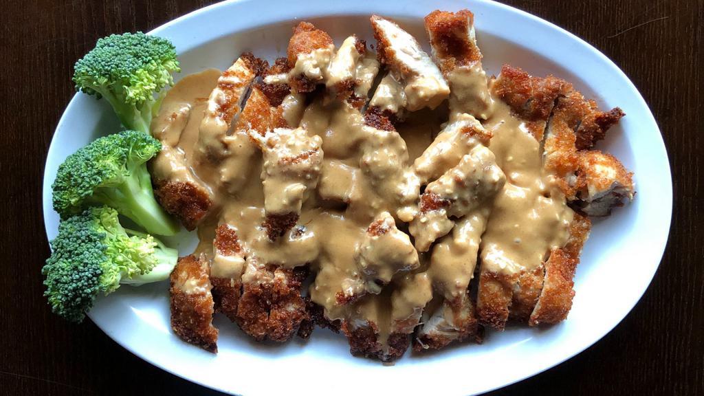 Peanut Chicken · Deep fried white meat chicken topping with creamy homemade peanut butter sauce!