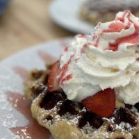 Strawberry Cheesecake · Pearl sugar waffle, strawberries, housemade cheesecake, strawberry glaze, whipped cream.