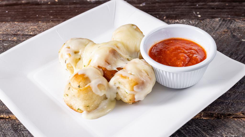 5 Pieces Garlic Knots With Mozzarella Cheese · With mozzarella cheese.