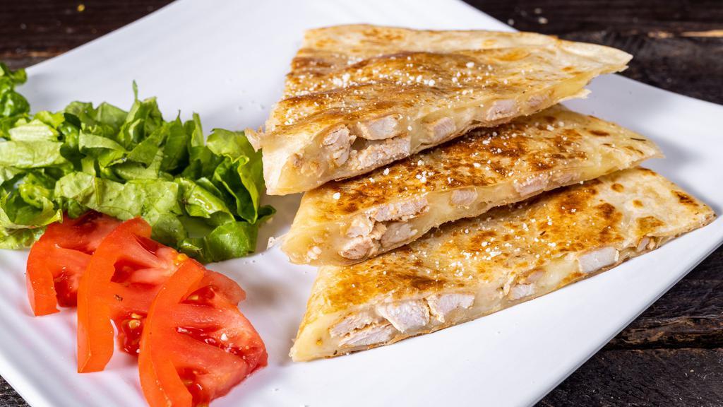Chicken Quesadilla · Served with lettuce, tomatoes, sour cream, mozzarella cheese and green sauce on the side.