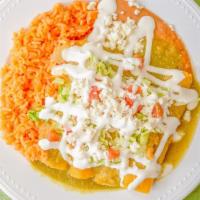 Enchiladas · 4 Corn tortillas rolled on your choice of either red or green sauce filled with pulled chick...