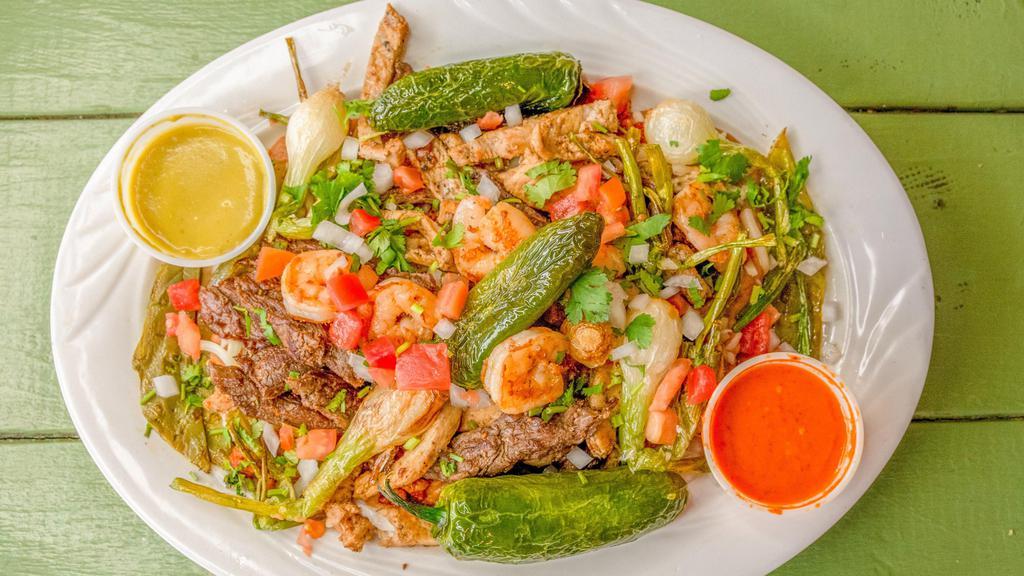Mix Fajitas / Chicken / Steak / Shrimp · The mix fajitas come with mixed bell peppers, onions, chicken, steak, shrimp all mixed together or you could choose to get just one meat of your choice . Also comes with rice, beans & a side of tortillas . Your choice of sauce .