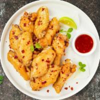 Oriental Sweet Asian Chili Wings · Fresh chicken wings breaded, fried until golden brown, and tossed in sweet asian chili sauce...