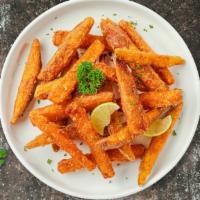 Sweet Spudtucular Fries · Thick-cut sweet potato wedges fried until golden brown