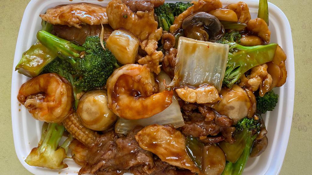 Happy Family · Shrimp, scallop, roast pork, chicken, beef, mushroom, bamboo shoots, snow peas, and Chinese vegetables. With white rice.