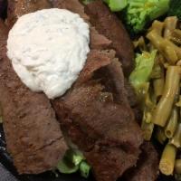 Gyro Dinner · Beef and lamb meat combined with spices, flame-broiled over an open pit and SERVED OVER SALA...