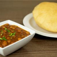 Chole Bhature · Garbanzo beans cooked with tomatoes and special masala served with deep fry house made fluff...