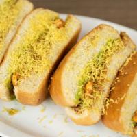 Dabeli (V) (2Pc) · Indian slider bun fill with special spiced infused potatoes with masala peanuts, onion, sev,...