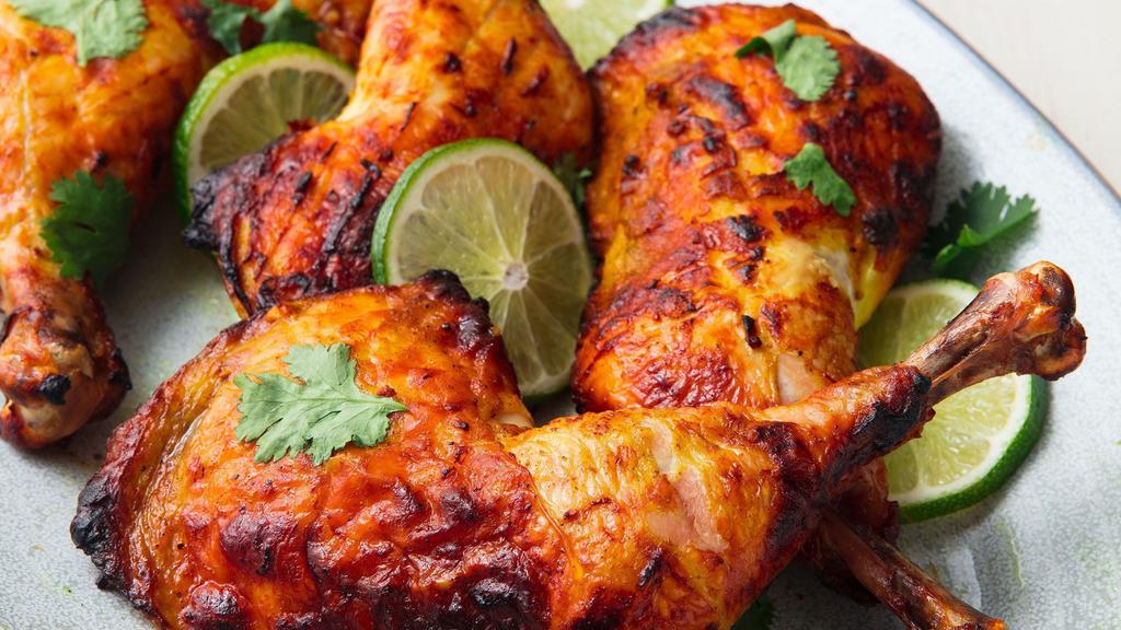 Whole Tandoori Chicken (G) · 4 Leg Quarters marinated in special tandoori masala, cooked in traditional clay oven. (Served with pulav.)