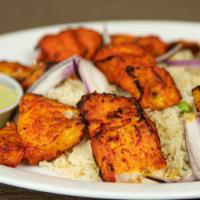 Tandoori Fish Tikka · Fish marinated in special tandoori masala, cooked in traditional clay oven. (Served with pul...