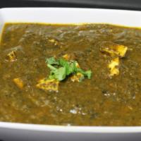 Palak Paneer (G) · Panner cooked with spinach, onions, ginger, garlic and a blend of Indian spices.