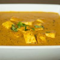 Paneer Tikka Masala (G) · Paneer cooked in tomato and onion base curry with touch of cream, herbs, and spices. (Served...