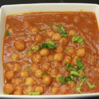 Chana Masala (G) · Garbanzo beans cooked in onions, garlic, ginger, tomatoes and blend of Indian spices, tradit...