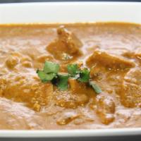 Butter Chicken (G) · Boneless  halal chicken  thigh cubes cooked in clay oven, cooked in special curry base of vi...