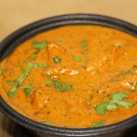 Chicken Korma (G) · Boneless Halal chicken thigh cooked in mild yogurt base curry sauce with a touch of cream an...