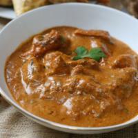 Lamb Curry (G) · Halal Lamb cooked in onions, garlic, ginger, tomatoes, with balances dry spices.