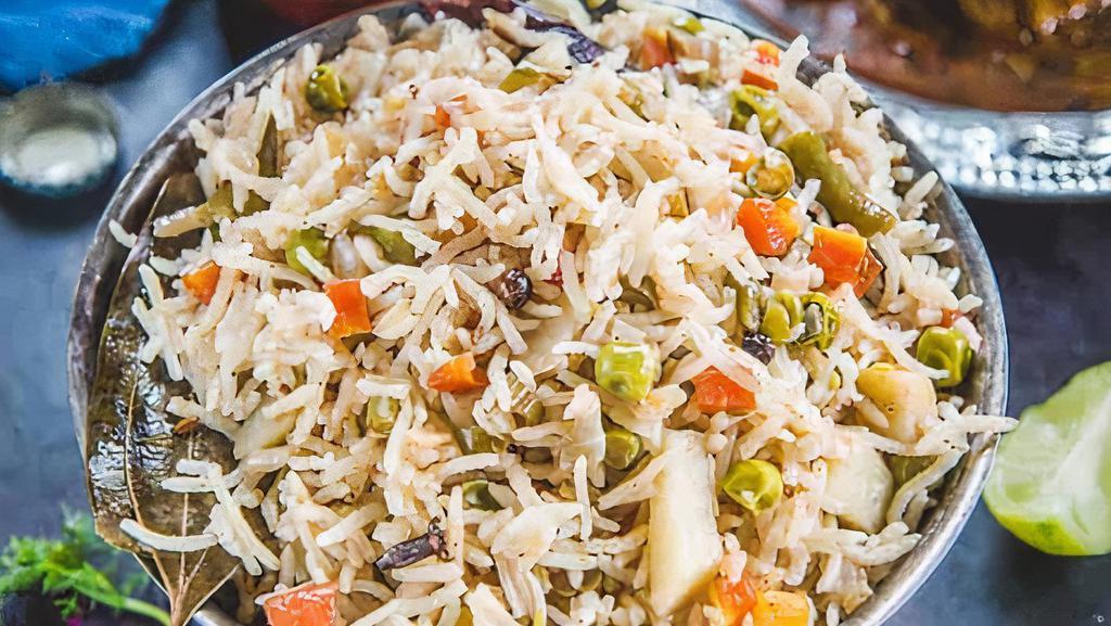 Vegetarian Pullav · Vegetarian Pullav is a flavored Indian rice dish made by cooking basmati rice with Onion,carrots,green peas  ,raisaine ,cumin & other fragrant spices