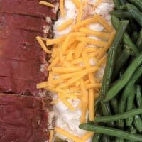 Family Size Meatloaf With Green Beans & Mashed Potatoes · Our homestyle meatloaf with traditional glaze, side of rich mashed potatoes and lightly seas...
